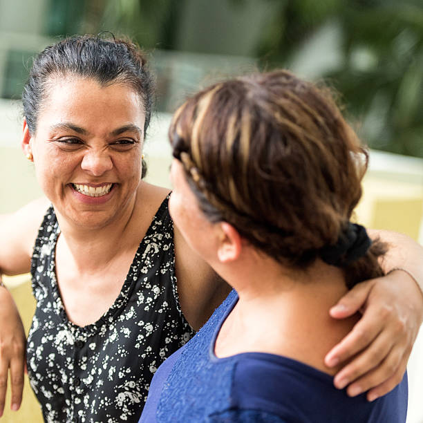 woman supporting another woman